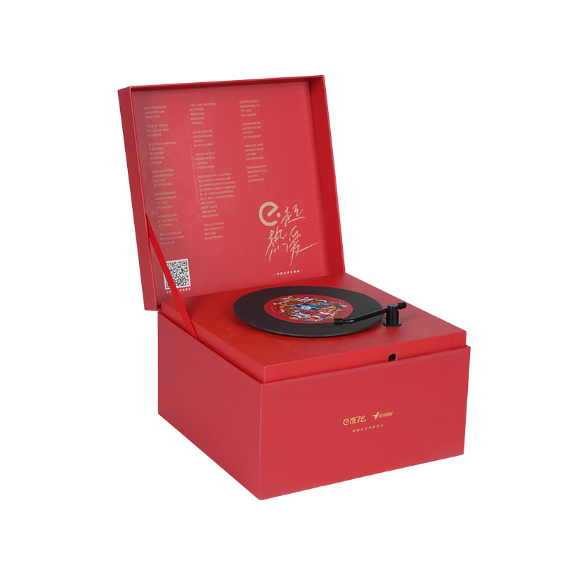 Caixa de música giratória em forma de livro com tema natalino